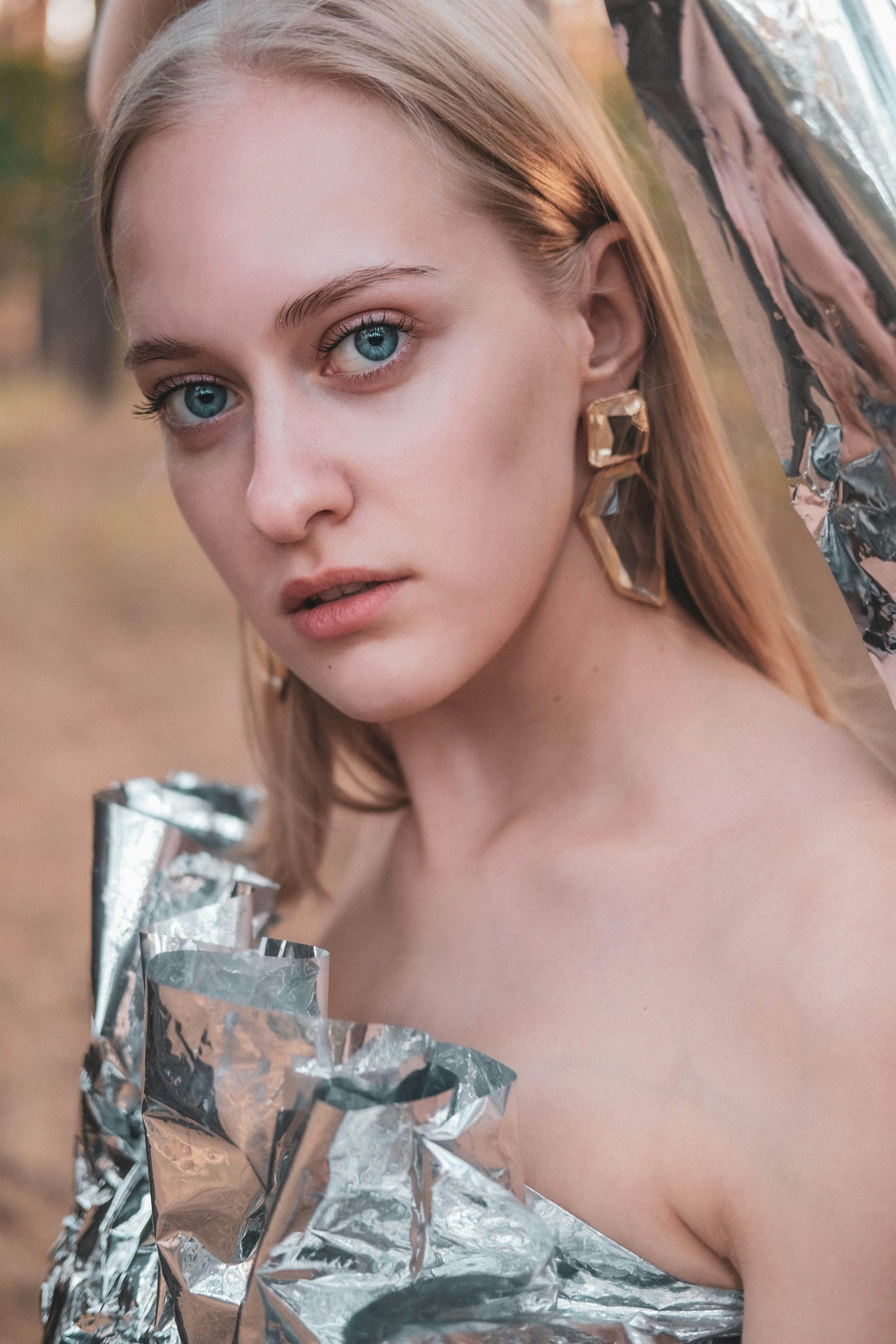 woman in silver and gold floral dress